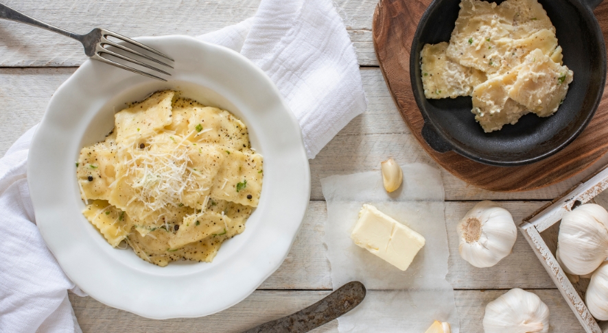 A dish of ravioli tossed with brown butter and cheese